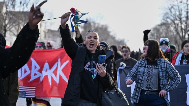 Minneapolis officials urge calm after fatal shooting of a woman by an ICE officer